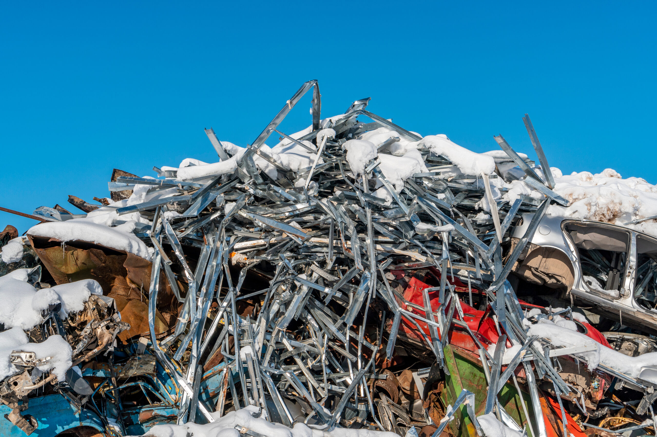 scrap metal in the winter with snow and ice