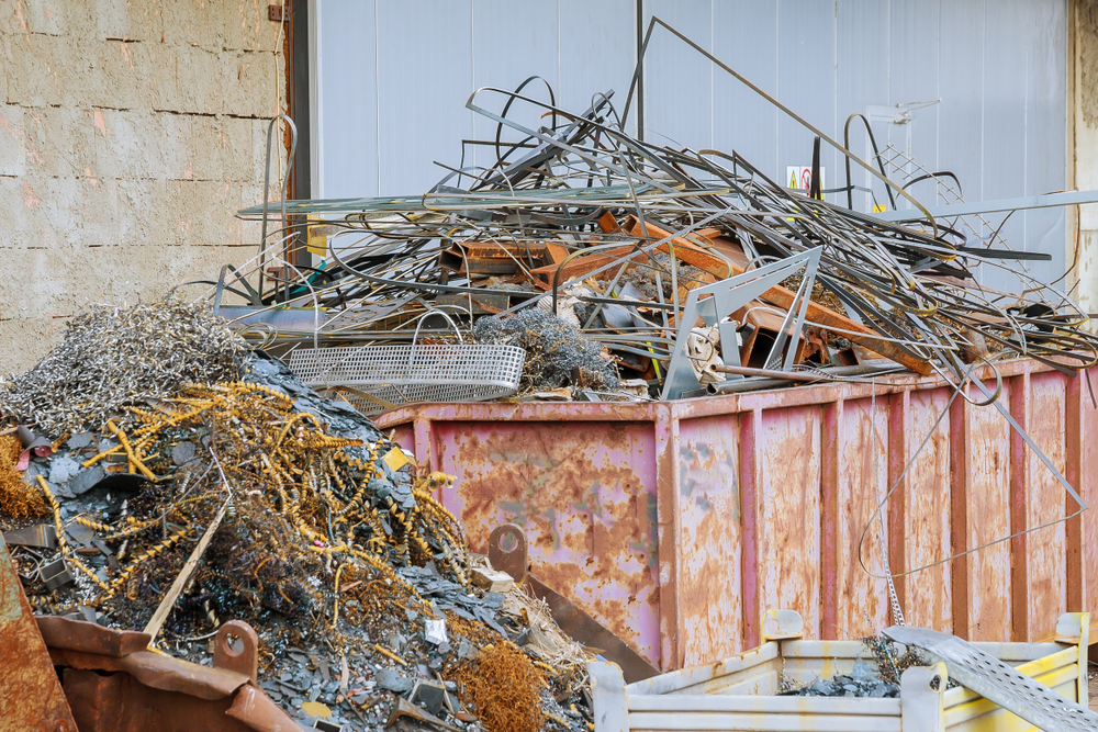 aluminum scrap metal in roll off dumpster